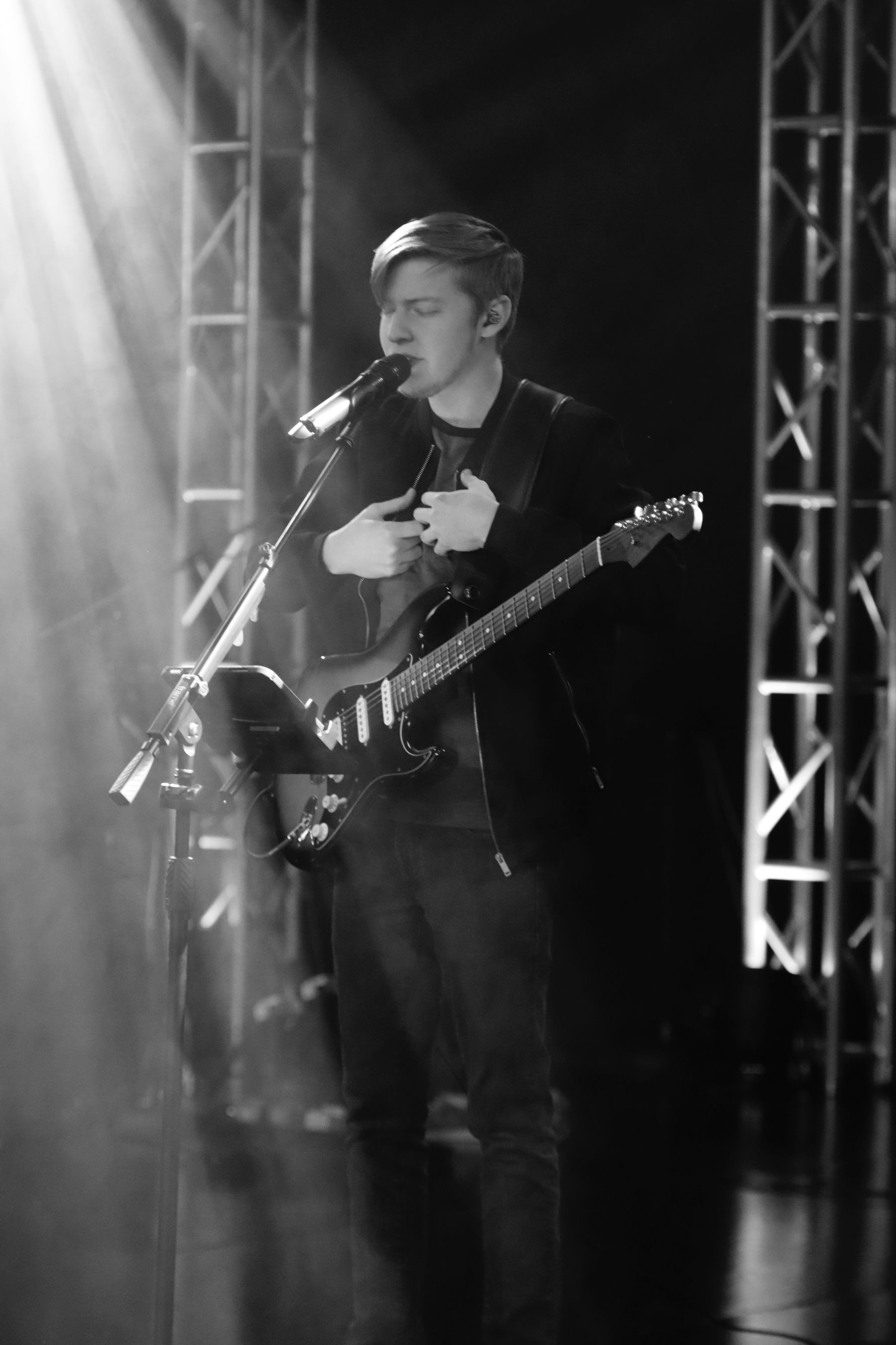Trevor performing with guitar