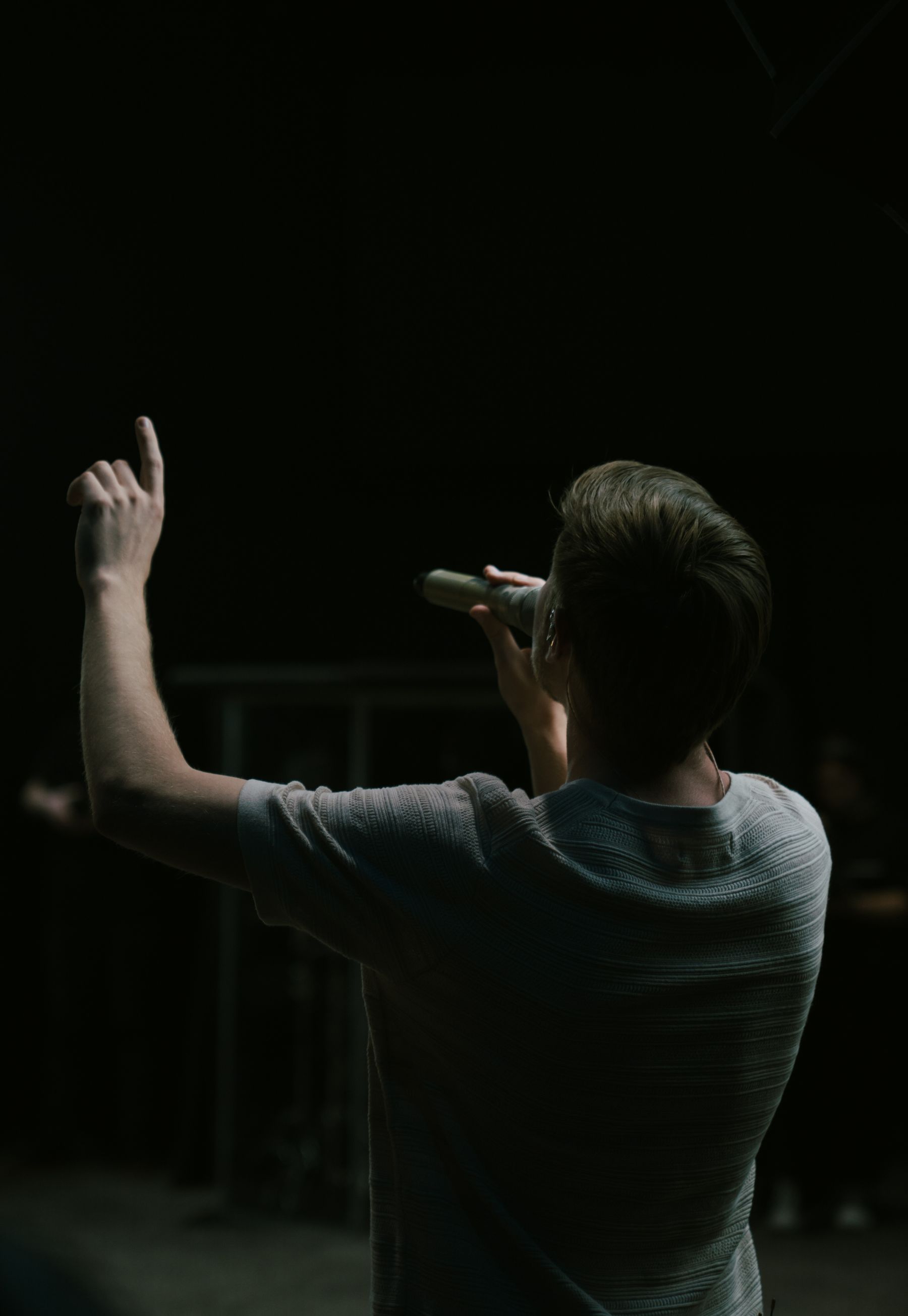 Trevor on stage with a microphone